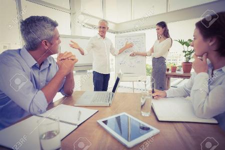 People in conversation around a table